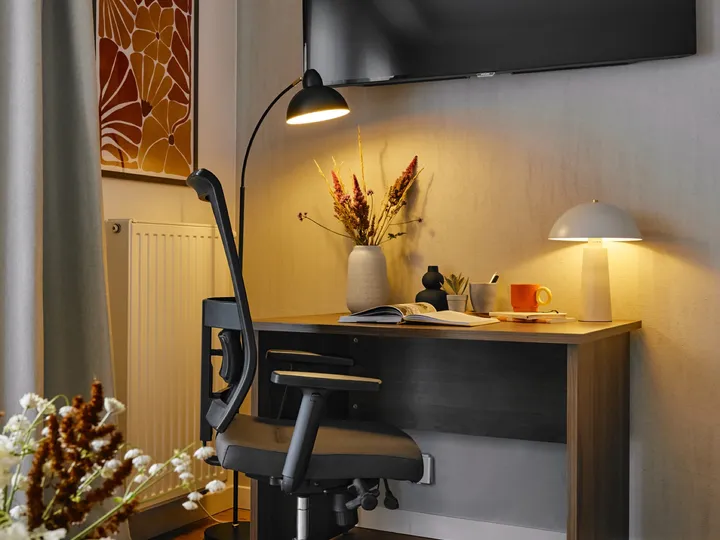 Desk with a lamp and office chair