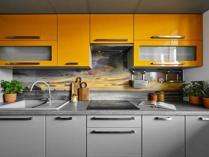 Yellow kitchen with hob and sink