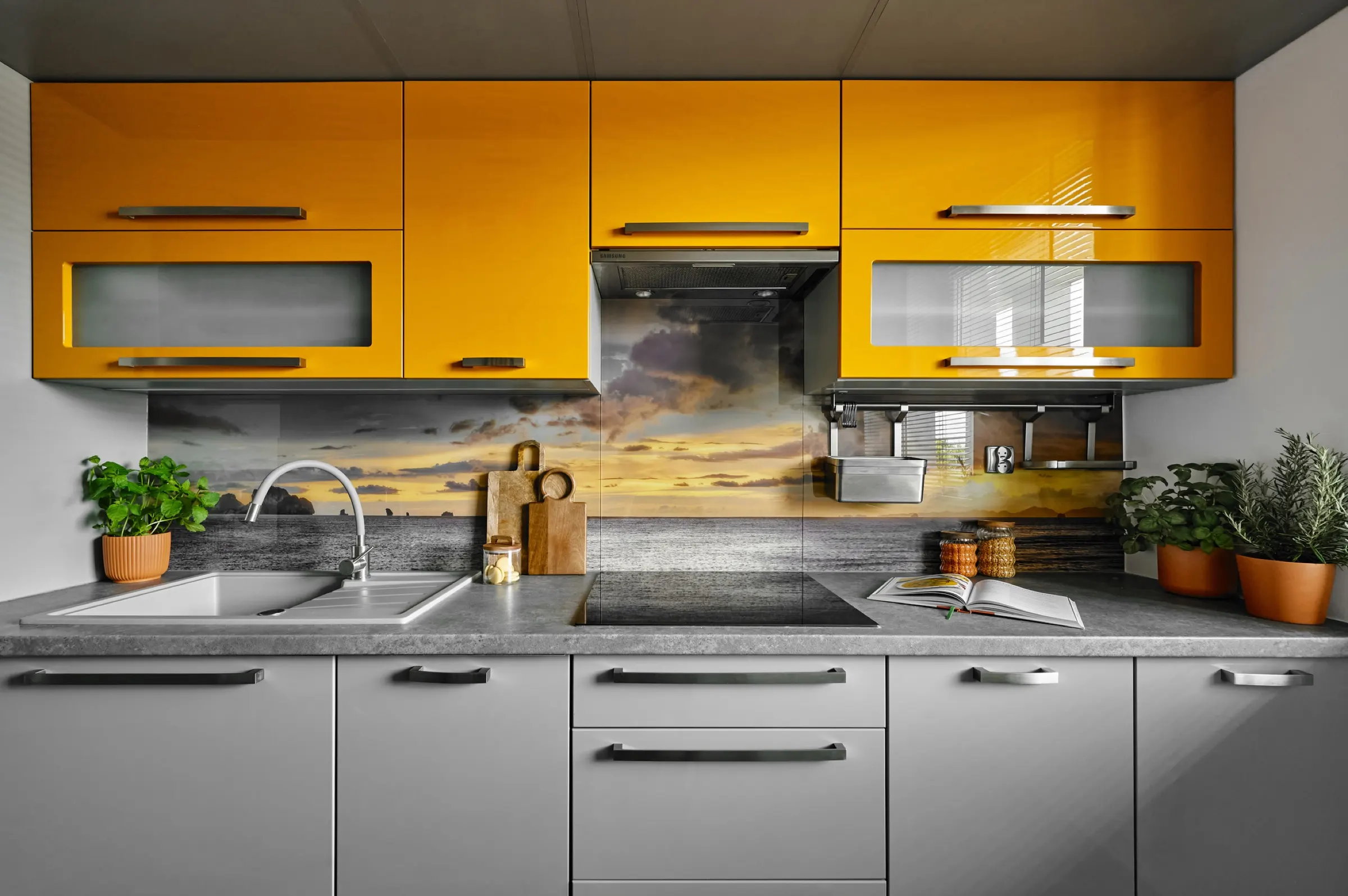 Yellow kitchen with hob and sink