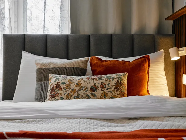 Bed with terracotta cushions