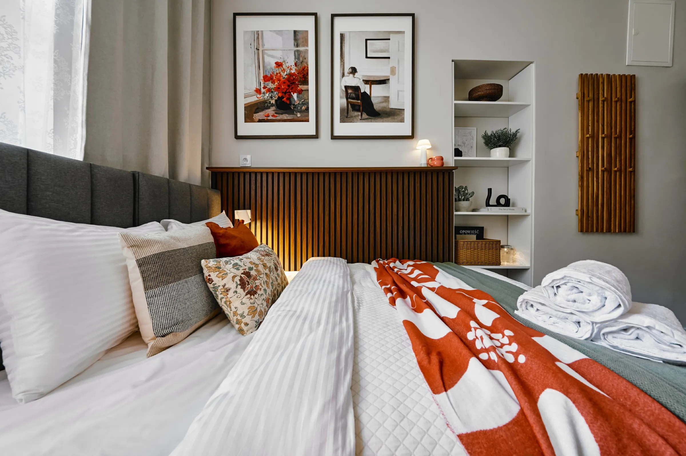 Patterned bedding with towels laid out