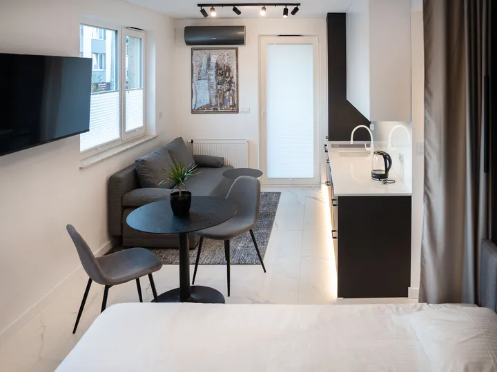Living area with a sofa, table and air conditioning