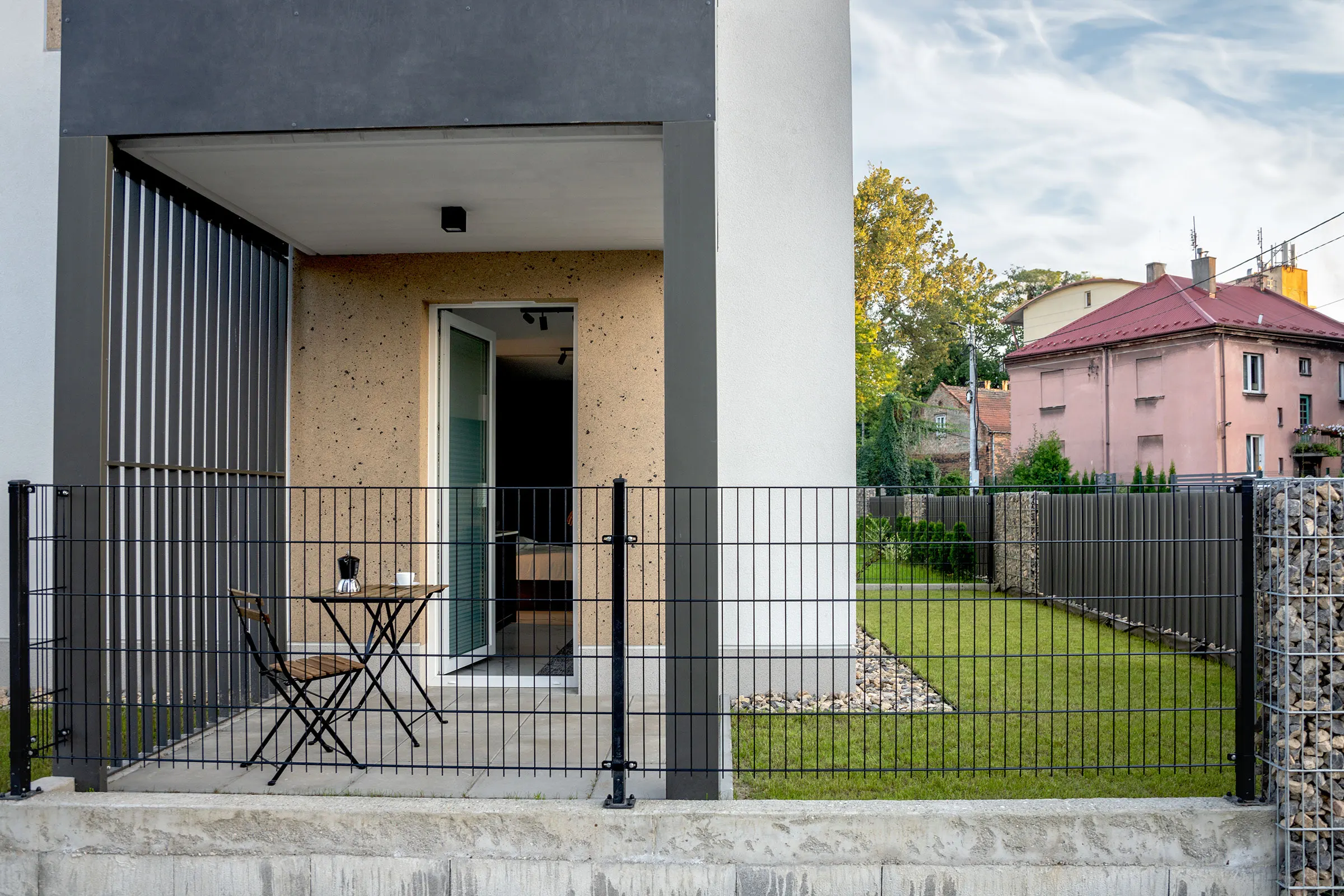 Private terrace with outdoor furniture and a lawn